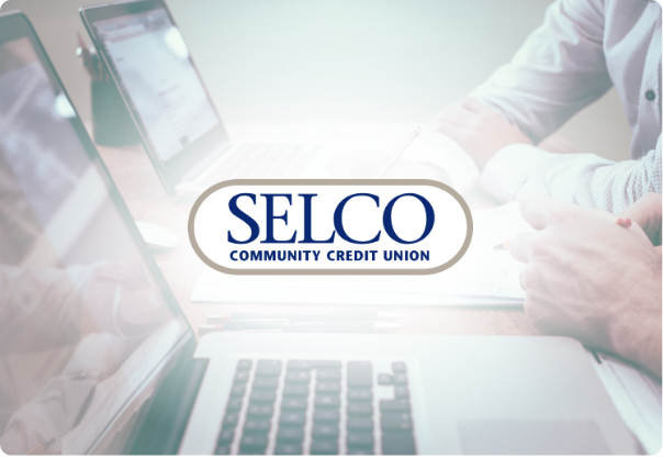 An image of people working on laptops with SELCO's logo overtop of it.